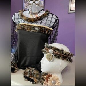 AS long sleeve black top with leopard fur trim and several matching accessories